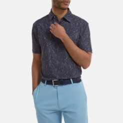 FootJoy Digital Camo FJ Print Lisle Golf Polo Shirt 11 FootJoy Digital Camo FJ Print Lisle Golf Polo Shirt -Golf Apparel Store FootJoy SS22 Digital Camo FJ Print Lisle Golf Polo Shirt Navy 88436 model 1